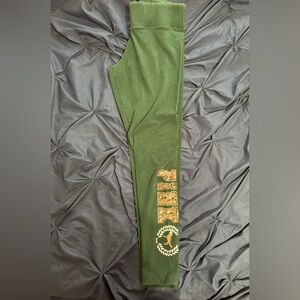 I’m selling PINK leggings that are green and gold with sequins. Size large.